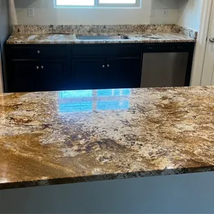 a kitchen with a granite countertop