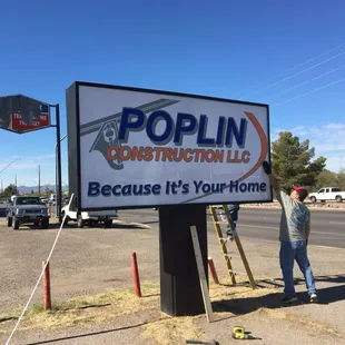 New signs going up at our new office.