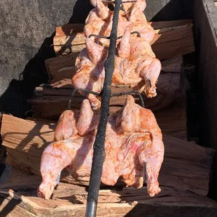 chicken being cooked on a grill