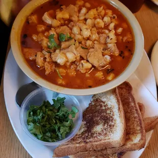 a bowl of soup and a grilled cheese sandwich