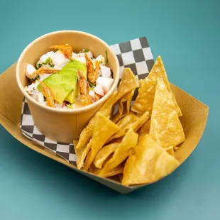 a bowl of chips and a bowl of salsa