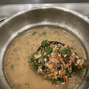 a bowl of soup with a spoon in it