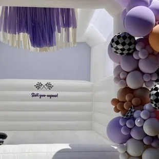 Balloon Garland attached to bounce-house.