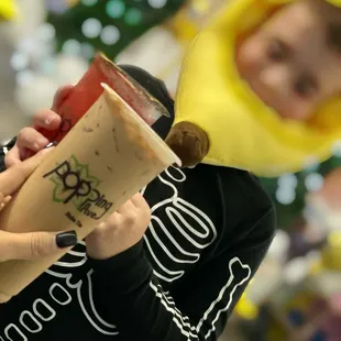 a woman holding a cup of coffee
