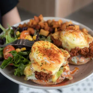 a person holding a plate of food