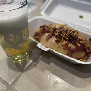Sandwich with a mango cart ale in a Yelp swag glass.