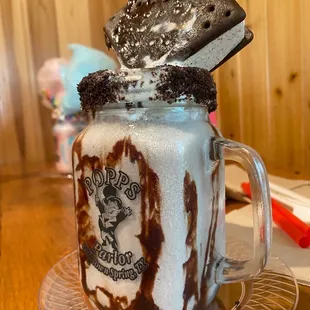 a chocolate milkshake in a mason jar