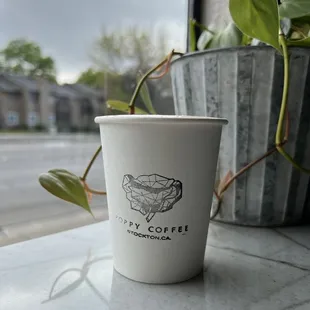 a cup of coffee on a table