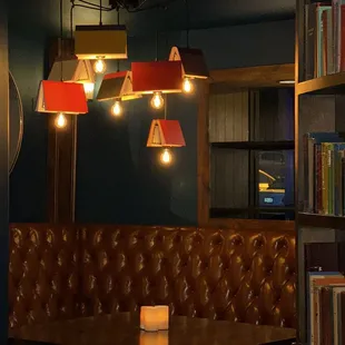 a leather booth with a table and chairs