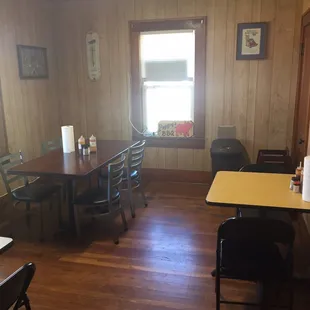 a dining room with a table and chairs