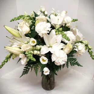 All white sympathy arrangement. Size and price may vary