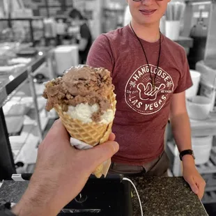 a man holding an ice cream cone