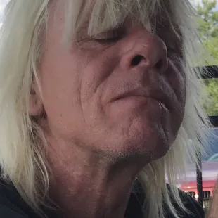 a man eating a hot dog