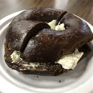 Pumpernickel bagel with pimento and olive cream cheese
