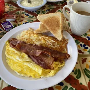 Scrambled Eggs, bacon, hash browns, toast and coffee