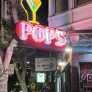 a neon sign for pop&apos;s