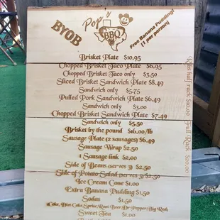 a menu on a wooden sign