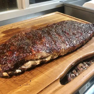 a large piece of meat on a cutting board