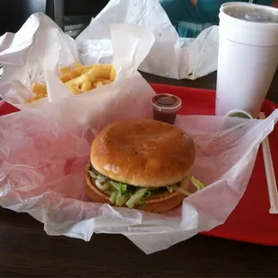 Large burger with fries.