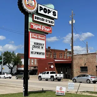 a sign for pop&apos;s burger stand