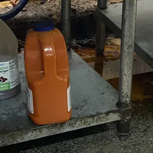 Oil and grease standing under grill at pops burger kitchen. One spark and it may be a huge problem