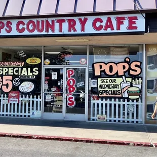a man standing in front of the store