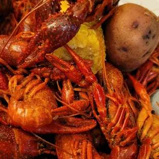 a pile of crawfish and potatoes