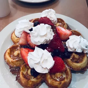 Berry waffles with cream cheese. Eggs and bacon.