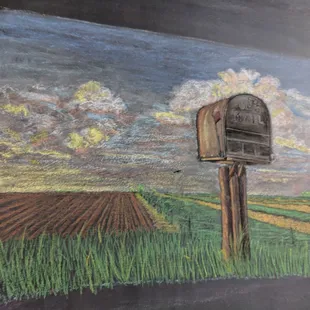 a chalk drawing of a mailbox in a field