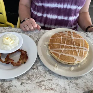 Big ass Cinnamon Pancakes with grits and bacon