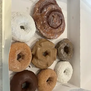 Cake donuts, powdered, sugar, blueberry &amp; chocolate. Maple old fashioned, cinnamon roll.