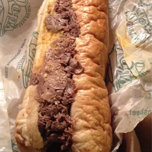 Super Beef- 9 inch beef sandwich with added cheddar cheese. Enough for 2!