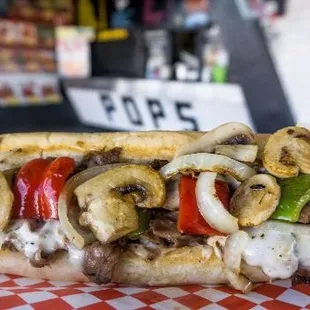 #32 Philly Cheesesteak with peppers, onions, mushrooms &amp; cheese. One of our most popular!