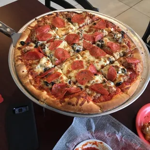  pepperoni pizza on a pan