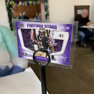 a photo of a football card on a stand