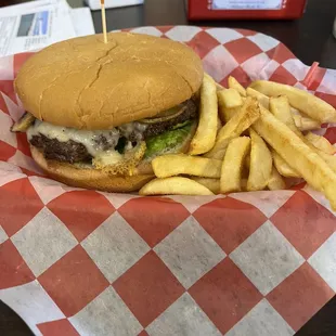 Mushroom Swiss burger with small fries.