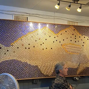 Beer bottle top fish mural