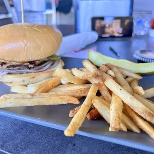 Grilled chicken sandwich with onions and avocado.