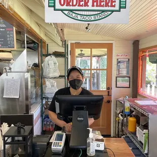 Helpful lady at Checkout Counter
