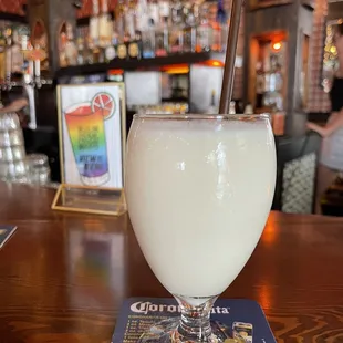 a drink in a glass on a bar