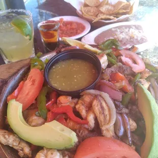 Shrimp, chicken, and steak fajitas. Cadillac Margarita was good at least.