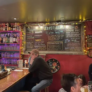 people sitting at a bar