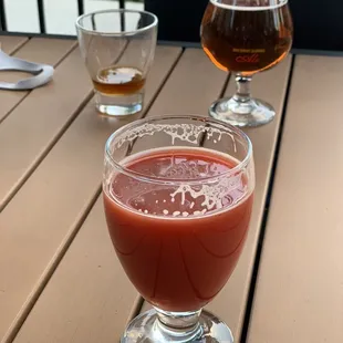 two glasses of beer on a wooden table