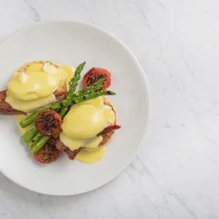 Thick-Cut Bacon &amp; Eggs Benedict Oven roasted tomato, grilled asparagus, classic hollandaise