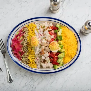 Smoked Turkey Cobb Deviled eggs, avocado, charred sweet corn, campari tomato, radish, pickled onion, sunflower seed, buttermilk ranch