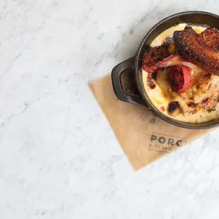 AJ&apos;s Hot Brown Smoked turkey, peppered bacon, cheese sauce, roasted tomato