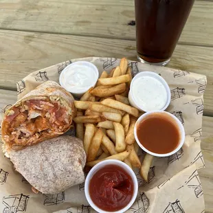 Buffalo chicken wrap with fries and a cold beer  so good! They have the best Buffalo sauce!