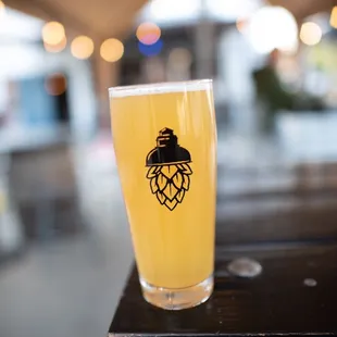 a glass of beer on a table
