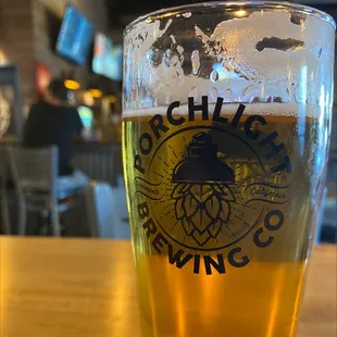 a glass of beer on a table