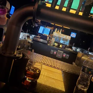 a bar with a television in the background